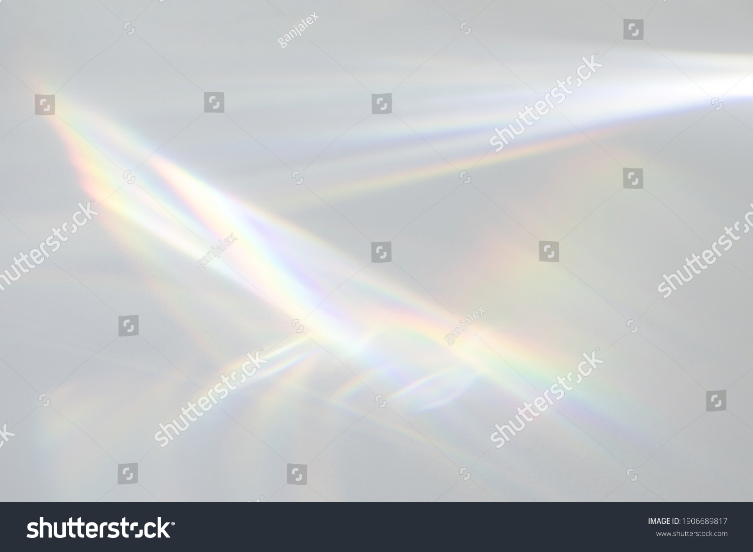 Blurred water texture overlay effect for photo and mockups. Organic drop diagonal shadow and light caustic effect on a white wall. Shadows for natural light effects #1906689817