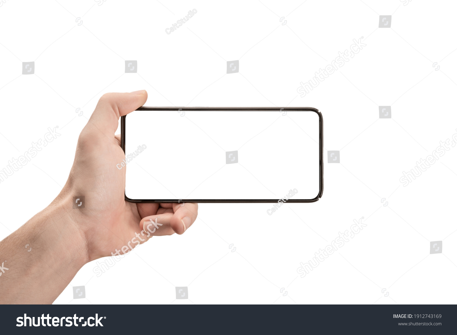 mockup phone horizontal. Hand Holding The Black Smartphone and Modern Frameless Design. Isolated man left hand holding black horizontal cellphone phone. watch tv streaming video movies online #1912743169