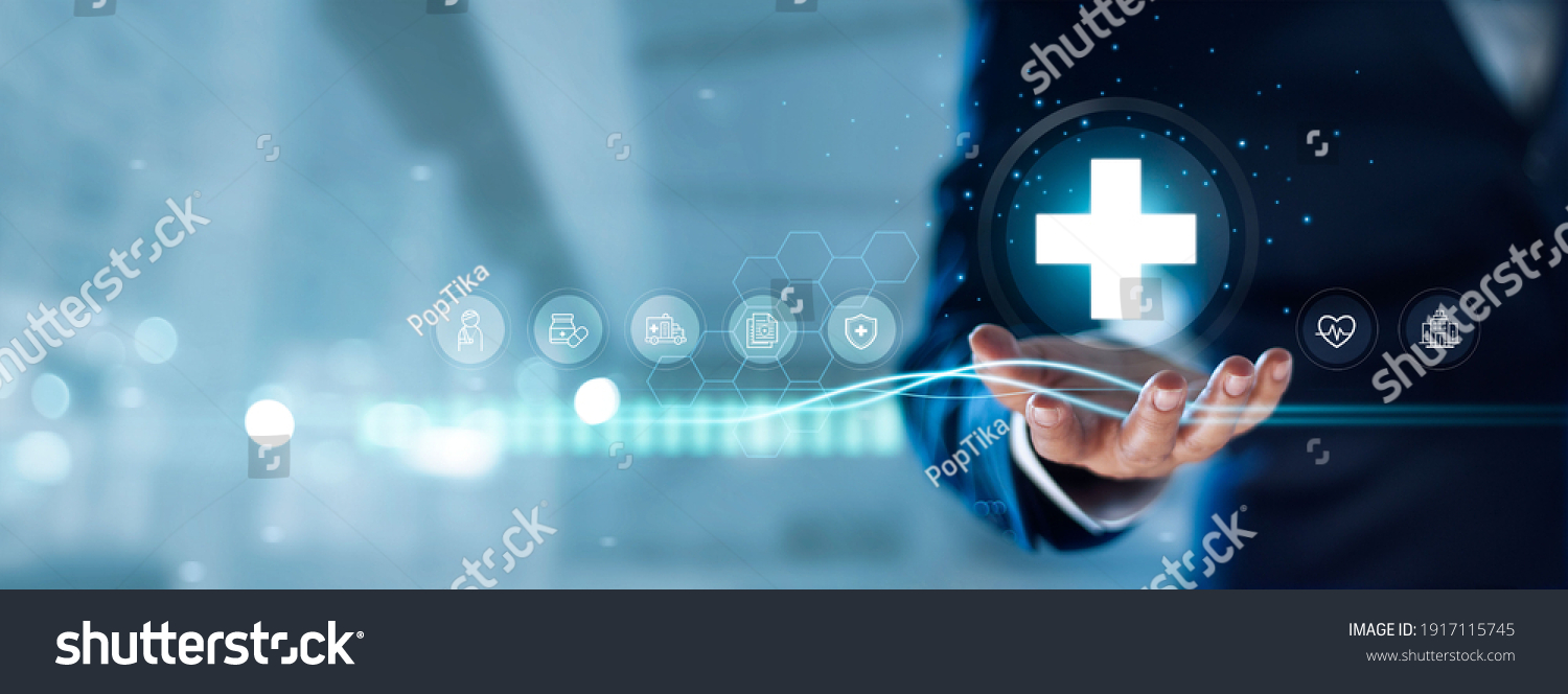 Businessman hold virtual medical network connection icons. Covid-19 pandemic develop people awareness and spread attention on their healthcare, rising growth in hospital and health insurance business. #1917115745