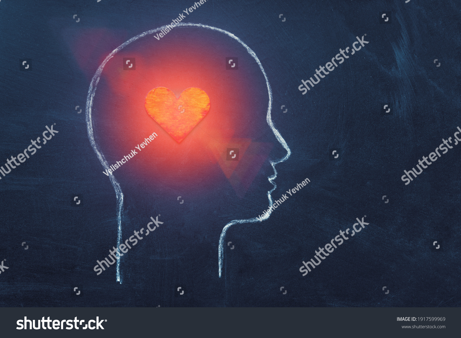 Shining Heart in human head. Love, instinct and romance concept. Chalk drawing. Copy space. Psychology, Valentine day, volunteer symbol. #1917599969