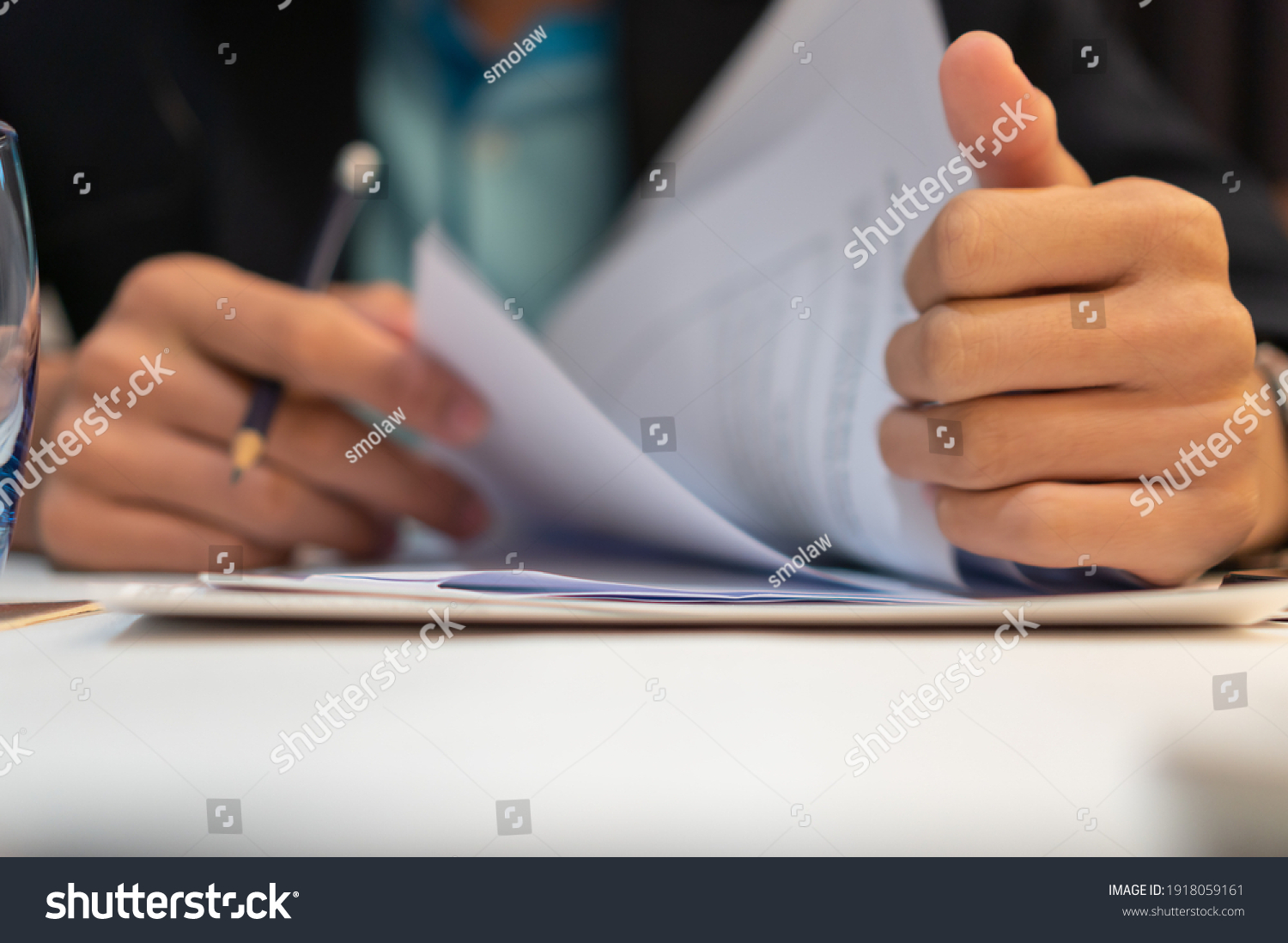 Start up learning for Document report business note in meeting room concept: Businessman manager hands writing for reading, signing in paperwork or documentation files at corporate on office desk #1918059161