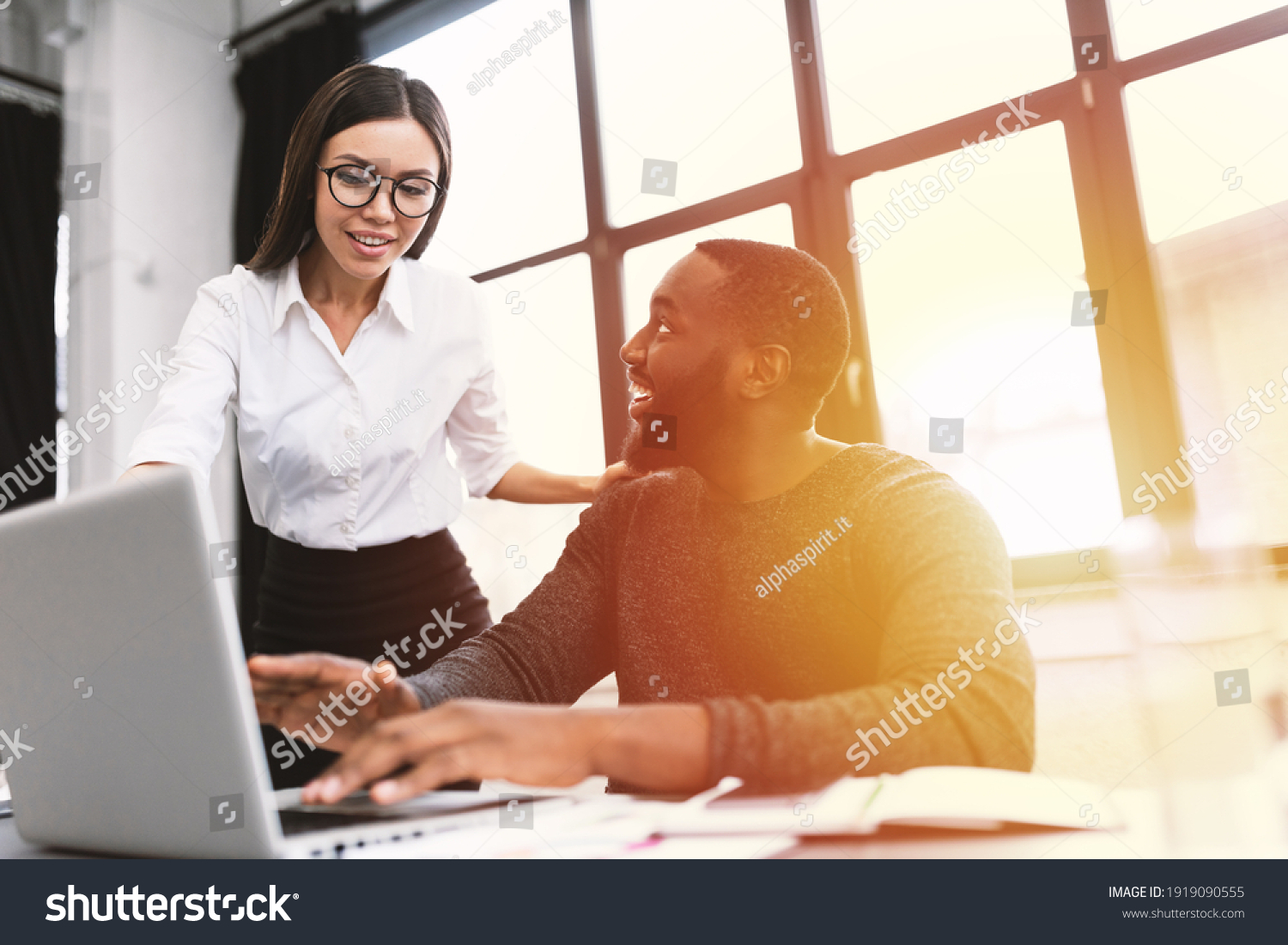 Young and heterogeneous co-workers working with pc in the office #1919090555