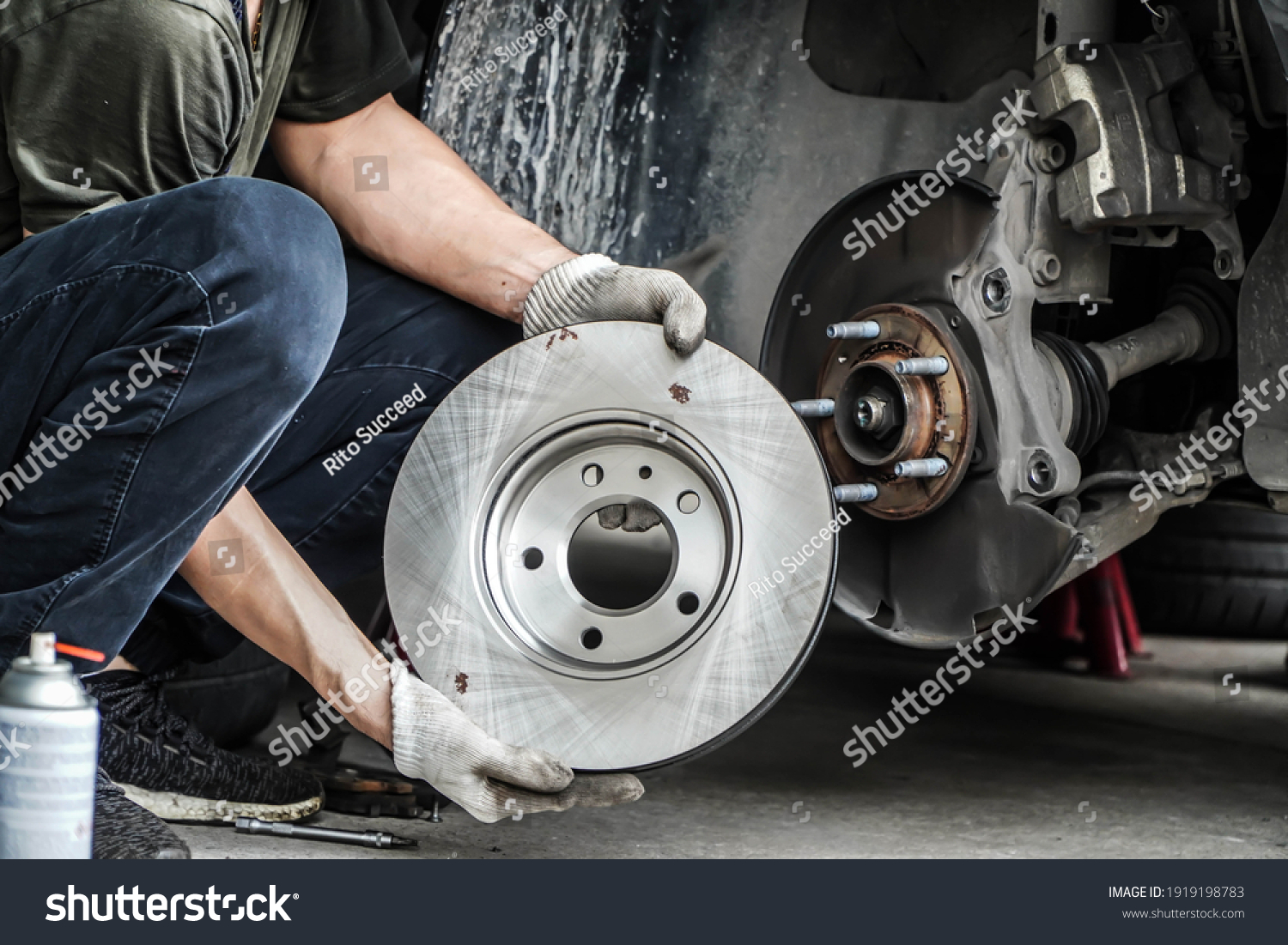 Brand new brake discs for garage cars. Auto mechanic,in process of new tire replacement, Car brake repairing in garage	 #1919198783
