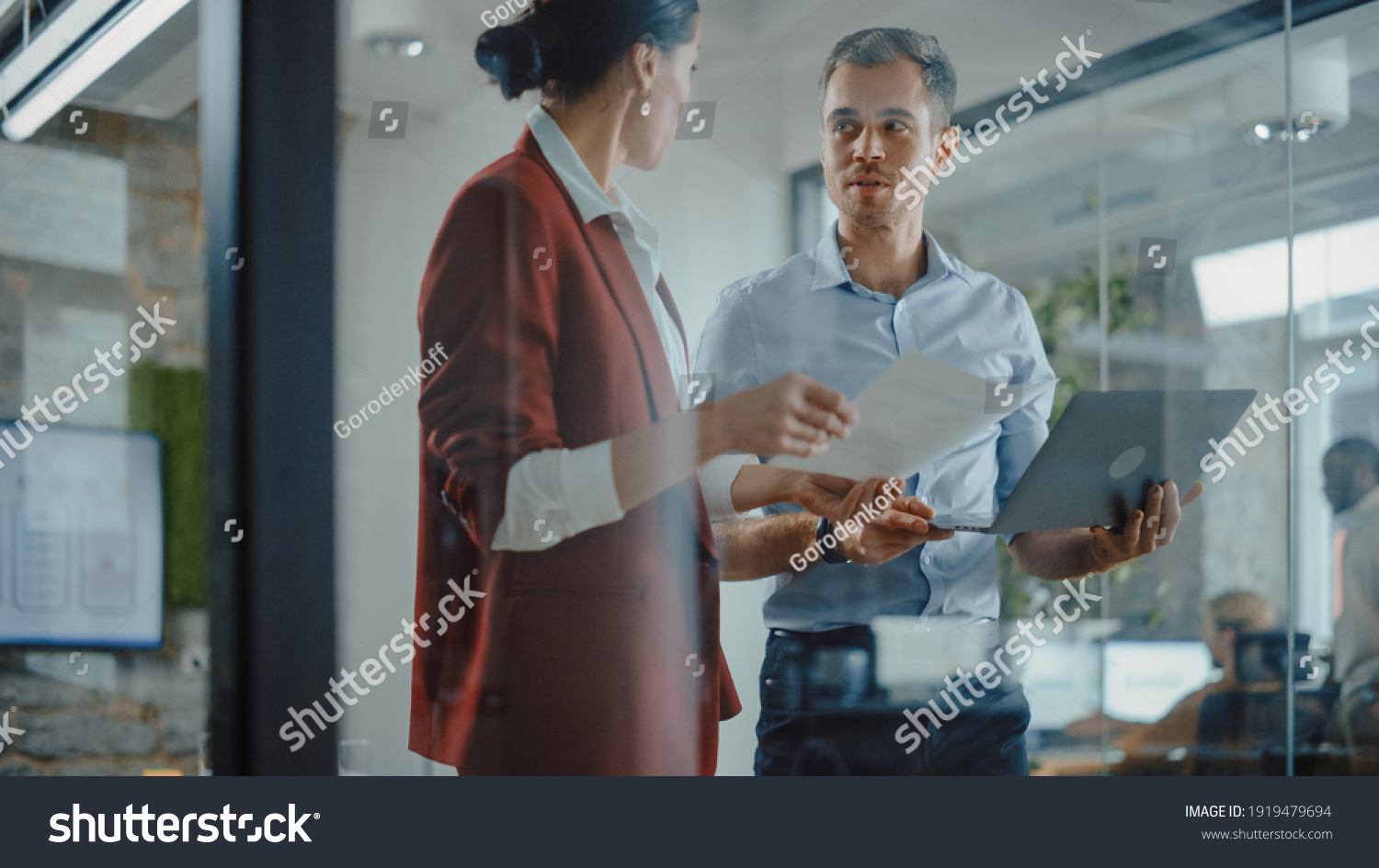 CEO and Chief Executive Talking About Company Business Growth, Consult Data Analysis and Use Laptop Computer. Two Professionals Discussing Revenue Increase, Market Disruption, Planning Strategy #1919479694