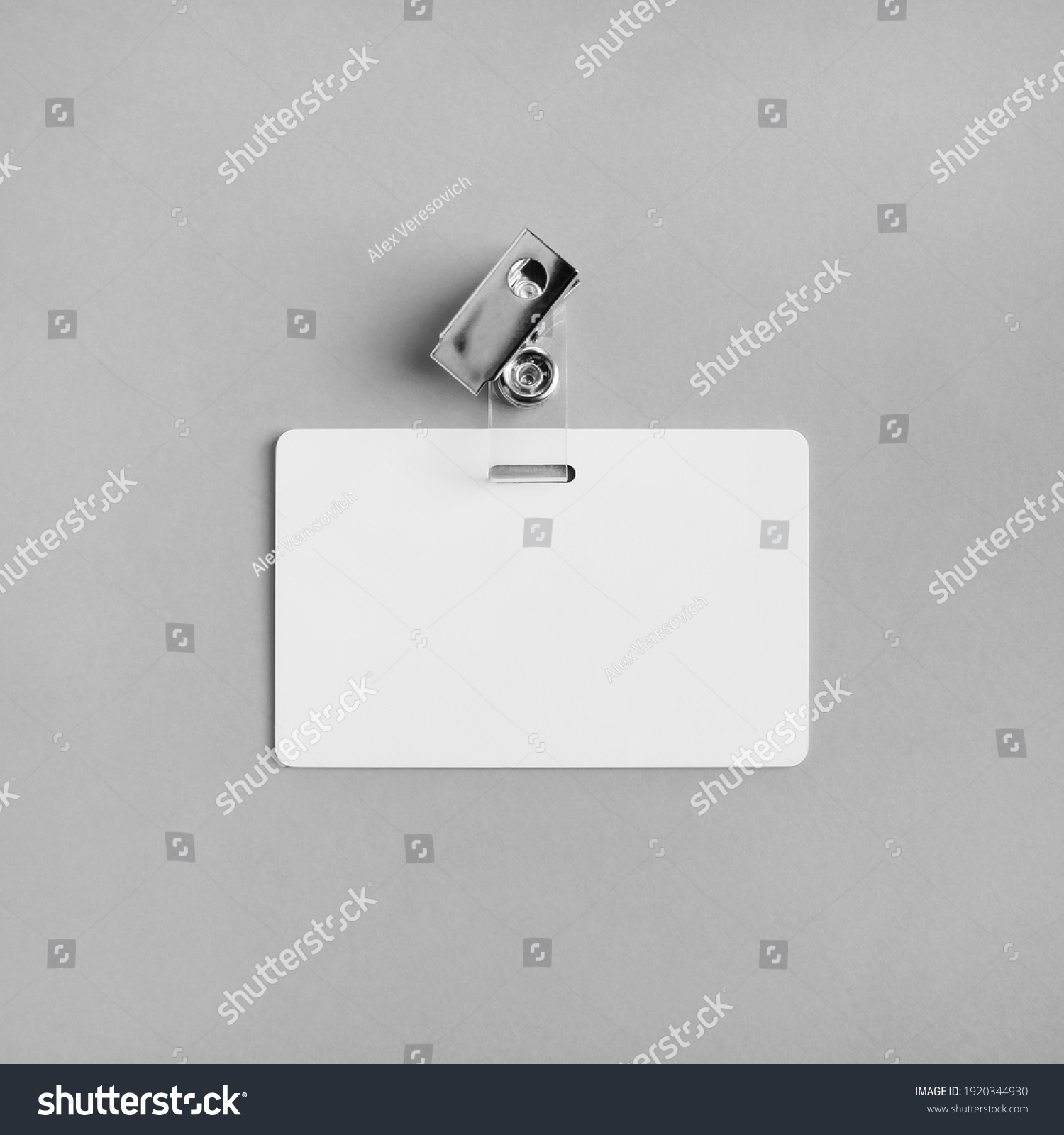 Blank white plastic badge on gray paper background. Responsive design template. Mock-up for your design. Flat lay. #1920344930