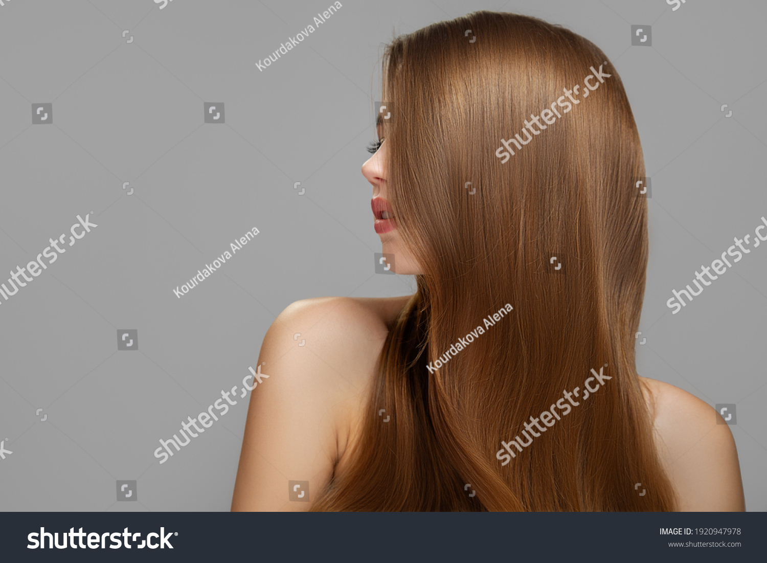 Woman's clean styled hair. Half of the face is covered with brunette hair #1920947978