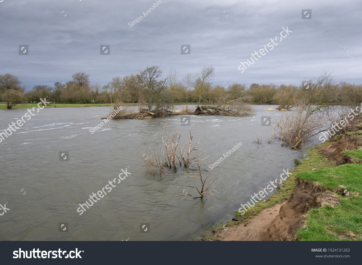 Flooded river with overcast sky #1924131263