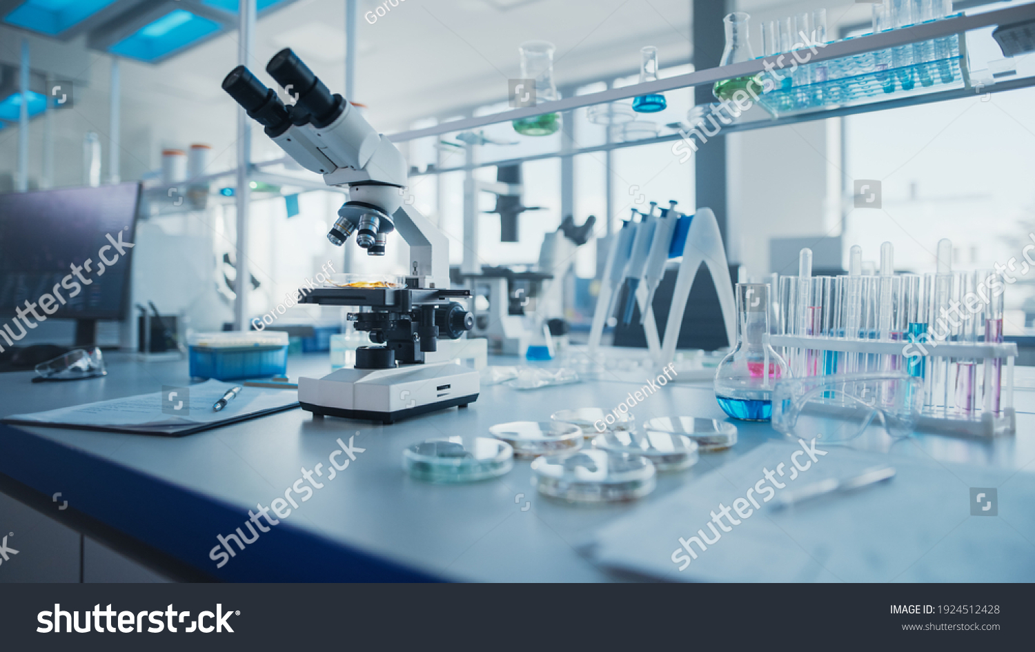 Modern Medical Research Laboratory with Microscope and Test Tubes with Biochemicals on the Desk. Scientific Lab Biotechnology Development Center of High-Tech Equipment, Technology. #1924512428