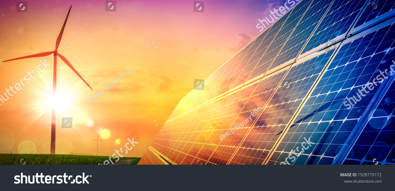 Wind Turbines And Solar Panels At Sunset - Renewable Energy Concept #1928779172