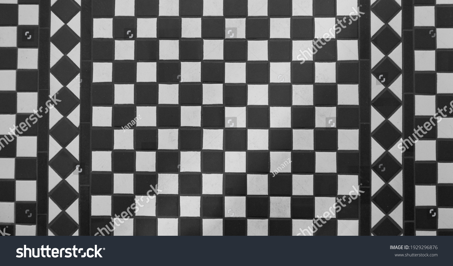 View of black and white tiled chequered Victorian floor from above #1929296876