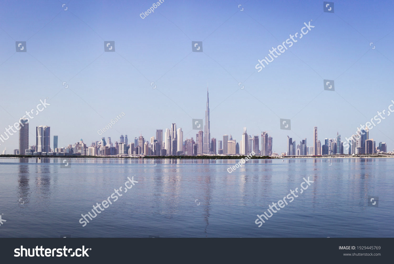 Dubai Downtown skyline panorama with reflections in Dubai Creek, cold colors, seen from Dubai Creek Harbour promenade. #1929445769