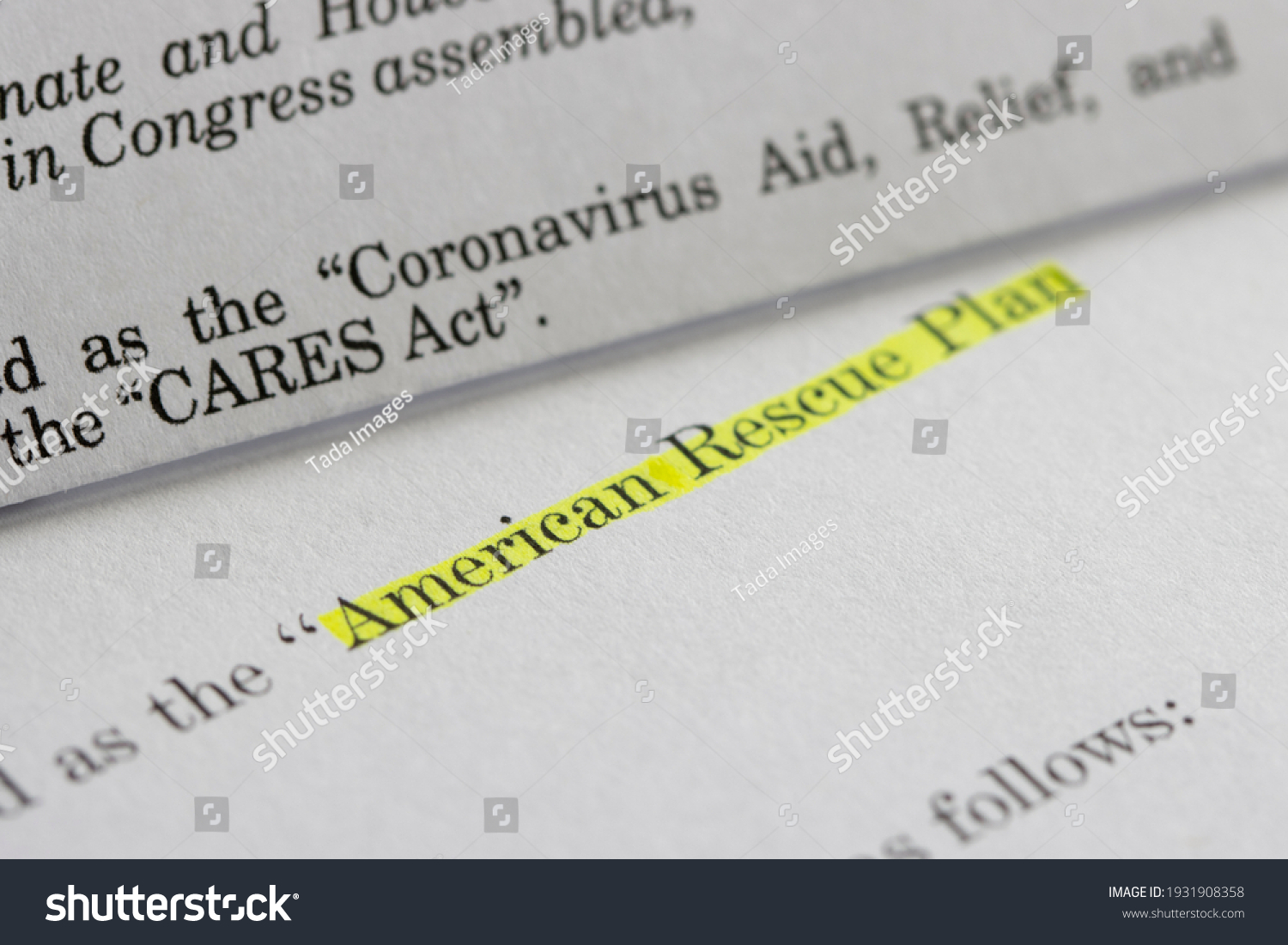 Closeup of the documents of both the Cares Act (Coronavirus Aid, Relief, and Economic Security Act) and the American Rescue Plan Act (ARPA) of 2021. #1931908358