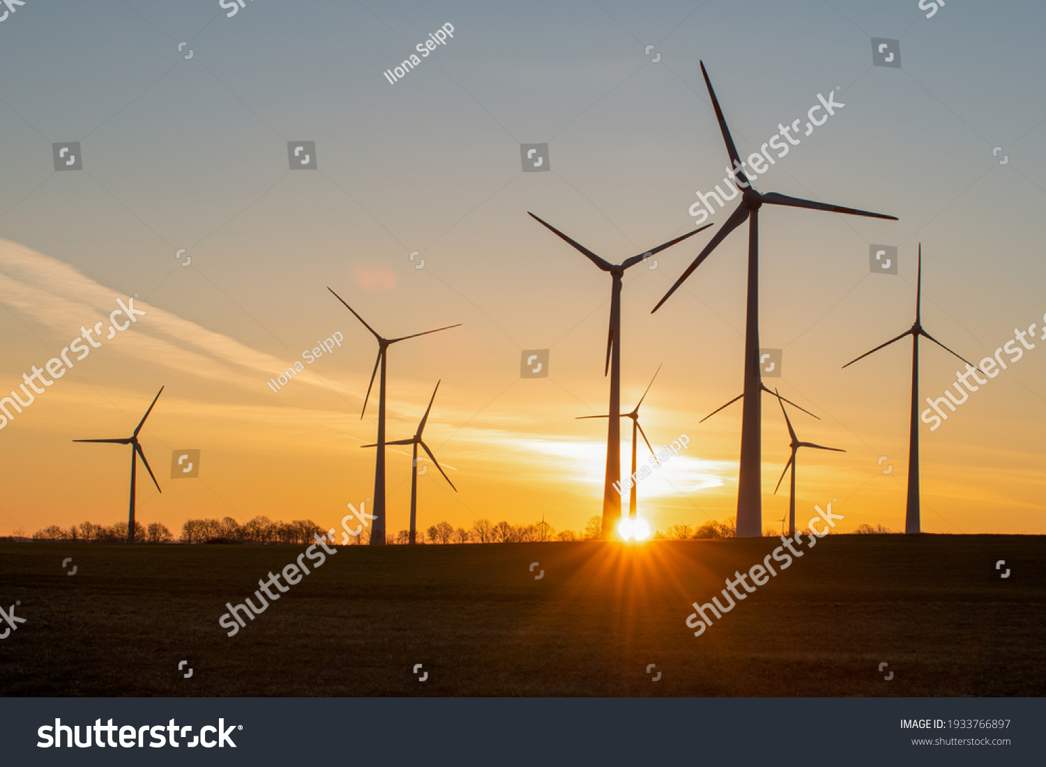 wind turbines in the rising sun #1933766897