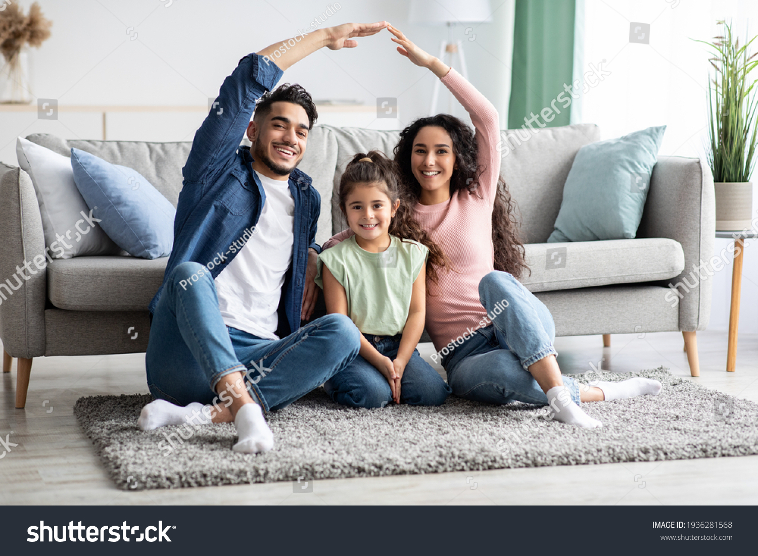 Family Protection. Mom And Dad Making Roof Of Hands Above Their Daughter #1936281568