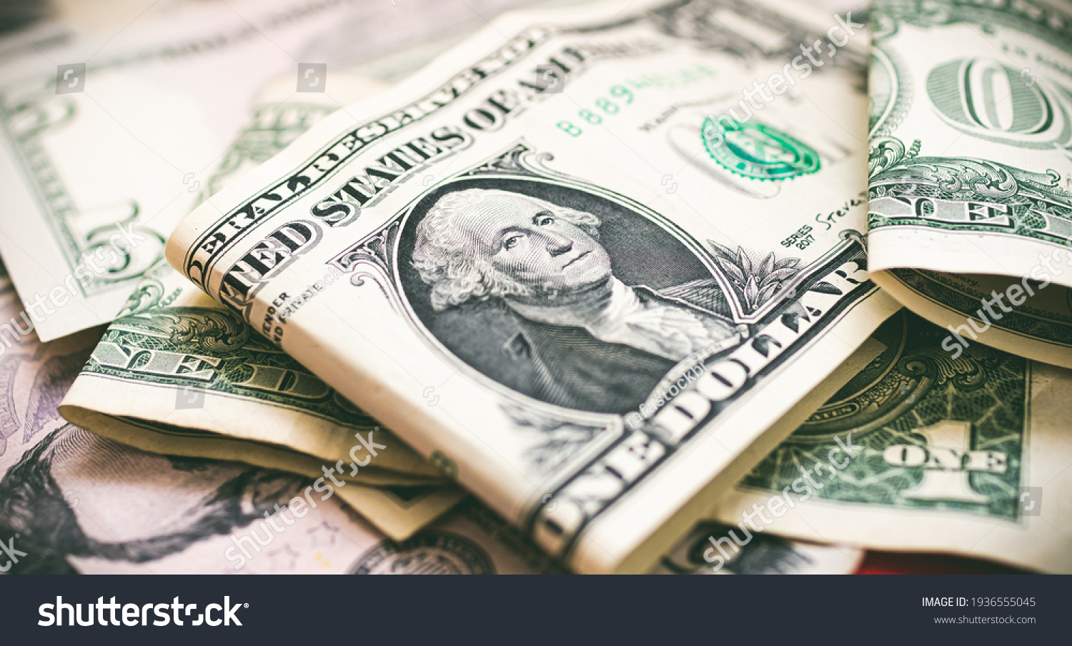 Money, US dollar bills background. Money scattered on the desk. Photography for Finance and Economy concepts.  #1936555045