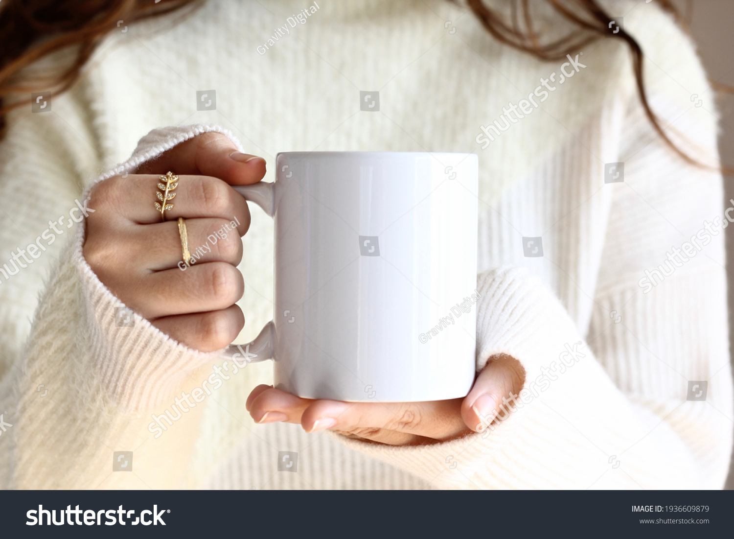 Girl in white sweater holding white coffee mug  , white porcelain mug mock up  #1936609879