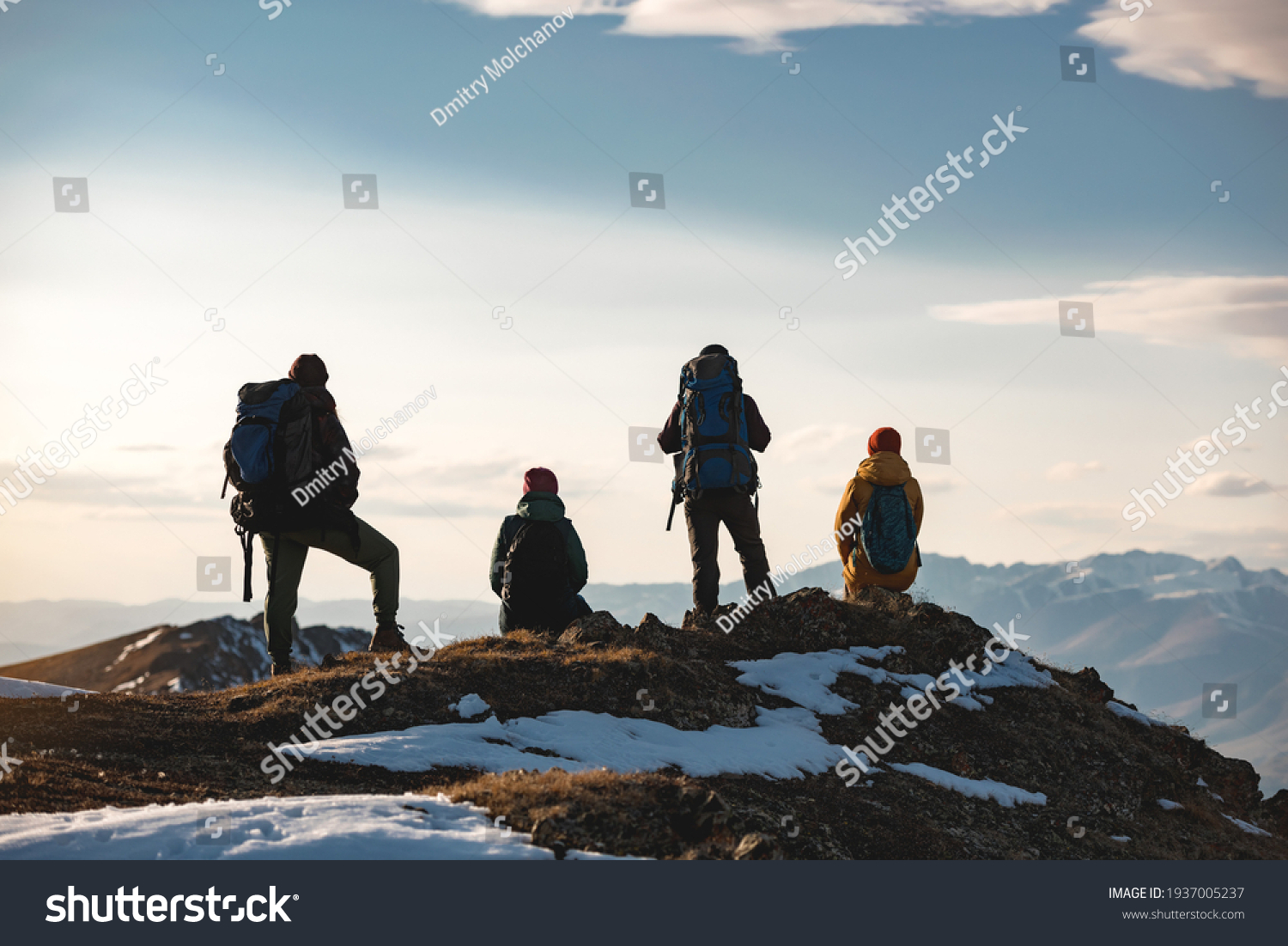 Four hikers are relaxing on mountain top #1937005237