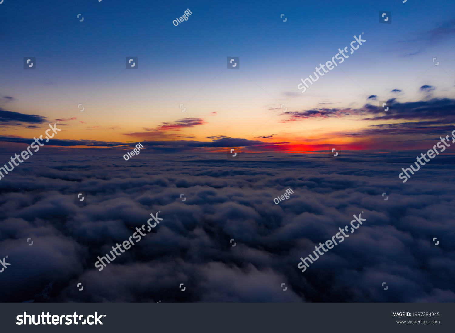 Aerial sunset view over the Blue Ridge Mountains from the cockpit of a private aircraft. Sky with clouds. Sky background #1937284945