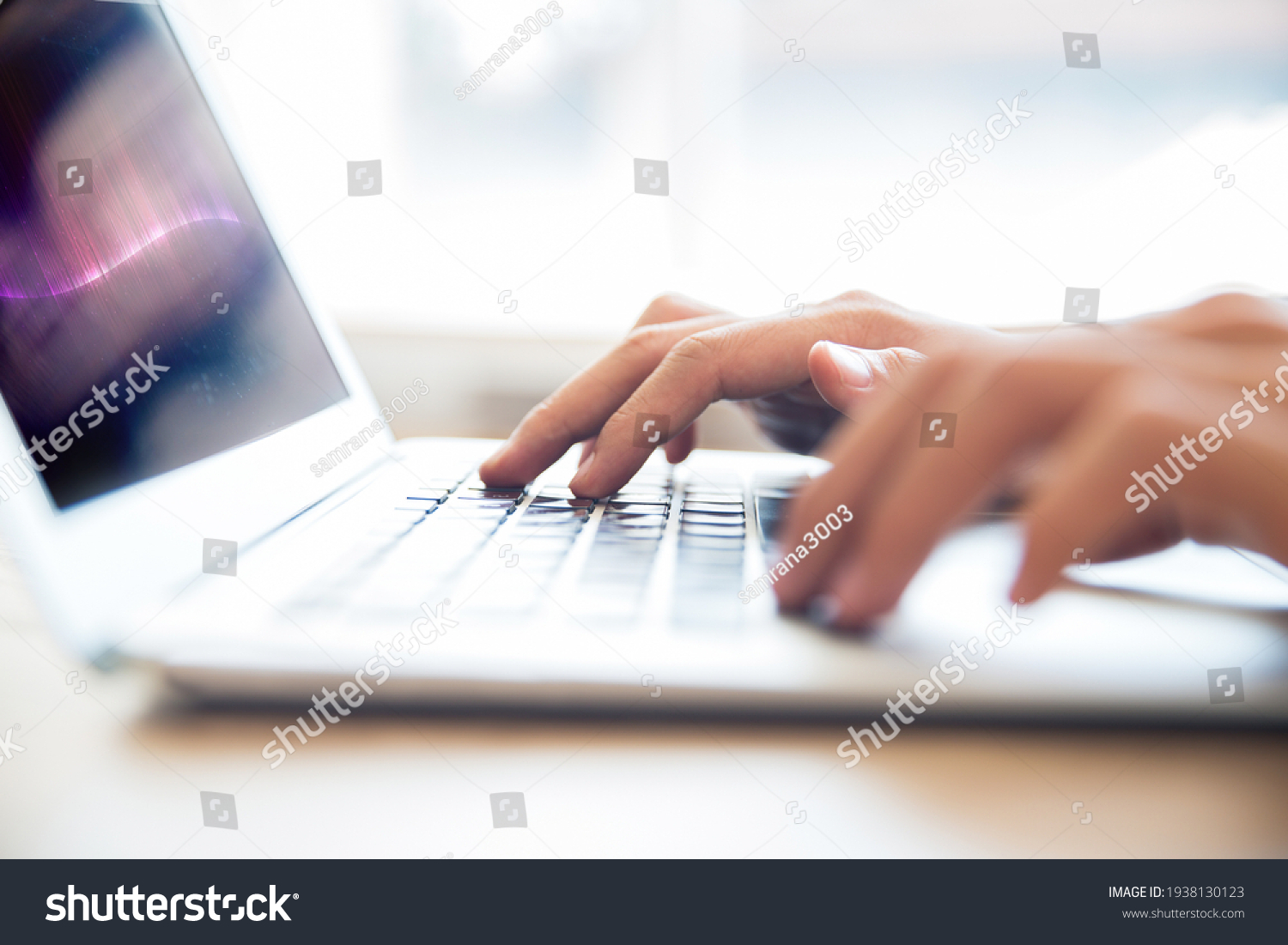 Close-up of male hands typing on laptop keyboard indoors. Businessman working in office or student browsing information #1938130123