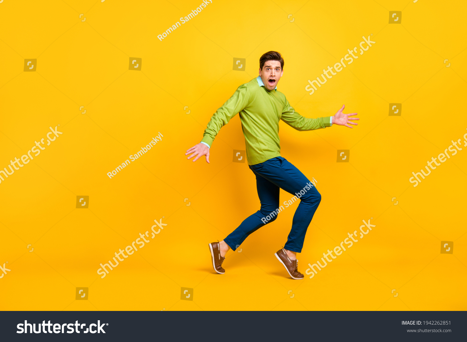 Full length body size profile side view of nice funky confused guy sneaking escaping tiptoe isolated on vivid yellow color background #1942262851