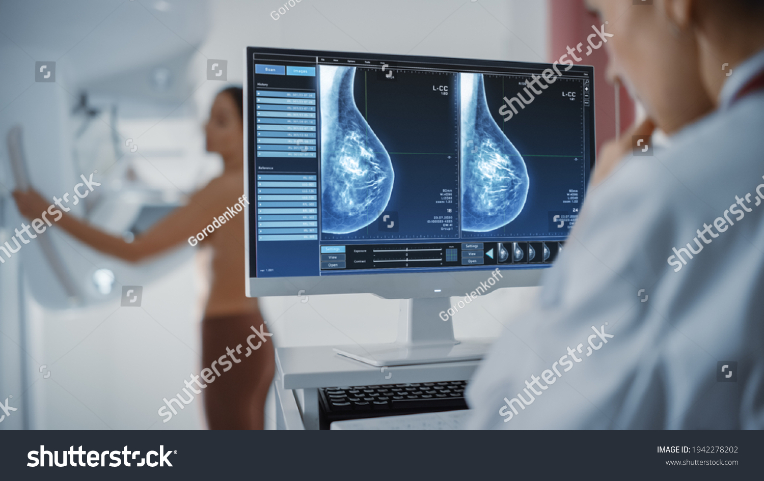 Computer Screen in Hospital Radiology Room: Beautiful Multiethnic Adult Woman Standing Topless Undergoing Mammography Screening Procedure. Screen Showing the Mammogram Scans of Dense Breast Tissues. #1942278202