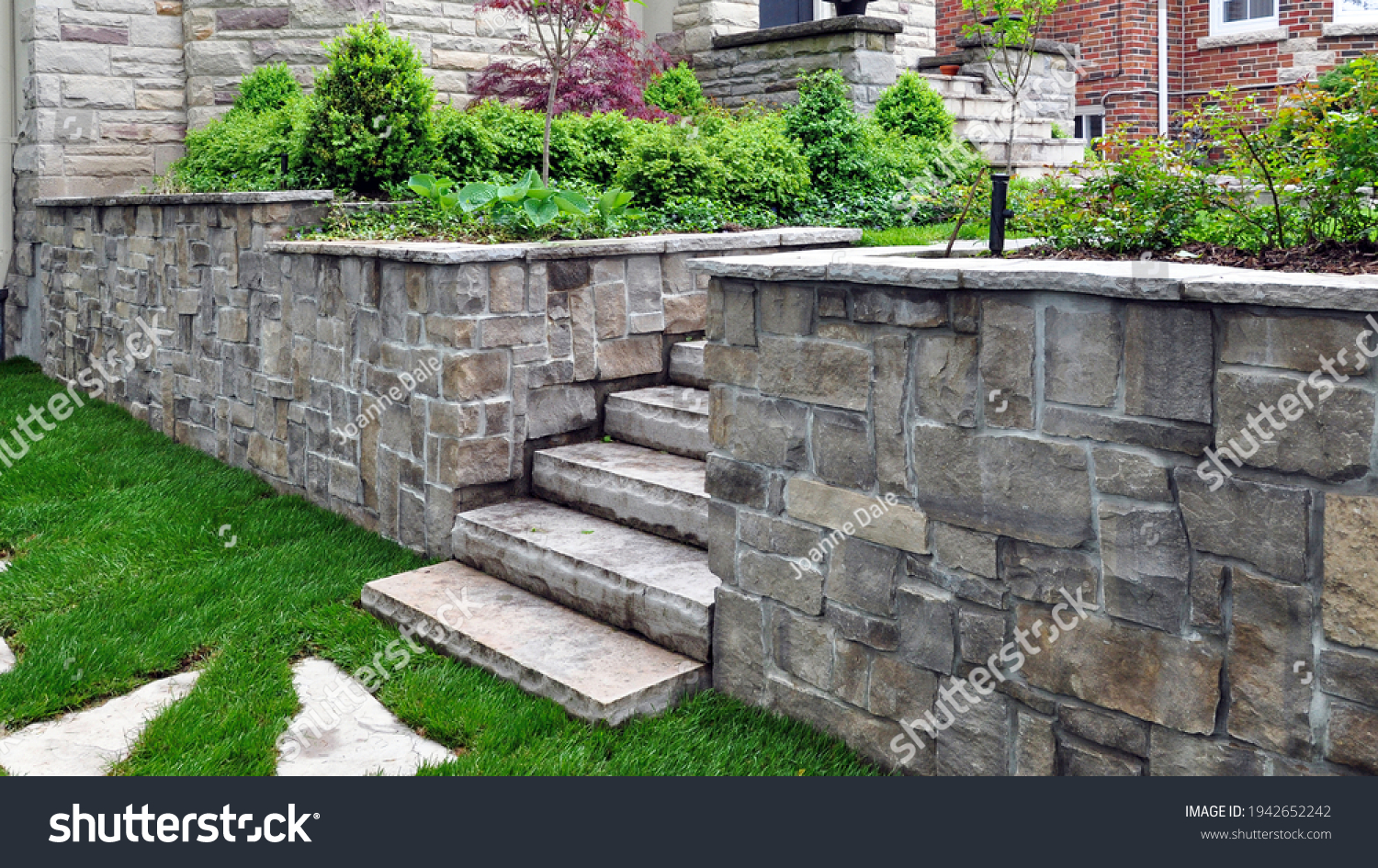 Natural stone steps and retaining wall in the garden. #1942652242