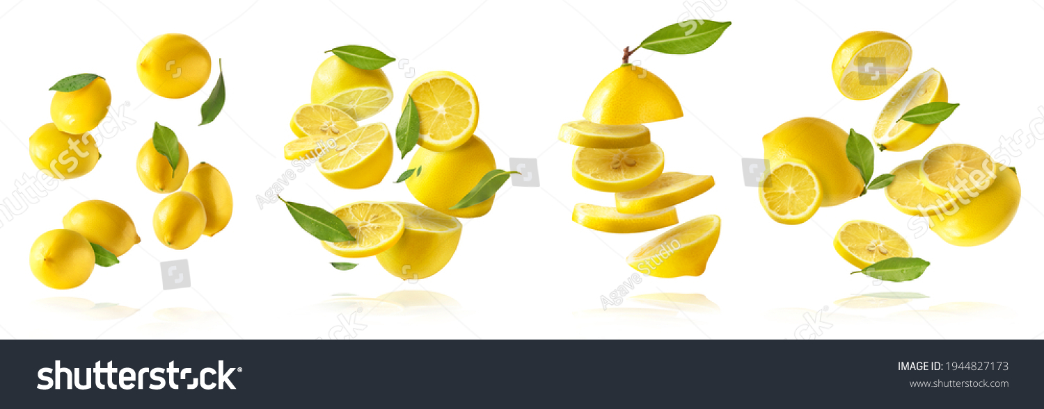 A creative set with Fresh raw whole and cut lemons with green leaves falling in the air isolated on white background. Food levitation or zero gravity conception. High resolution image #1944827173