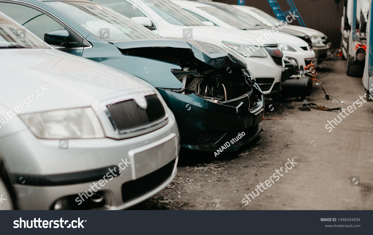 Wrecked cars after traffic accident crash. Insurance salvage vehicle auction wholesale storage. Featuring Used, Wholesale and Salvage Cars. #1948434934