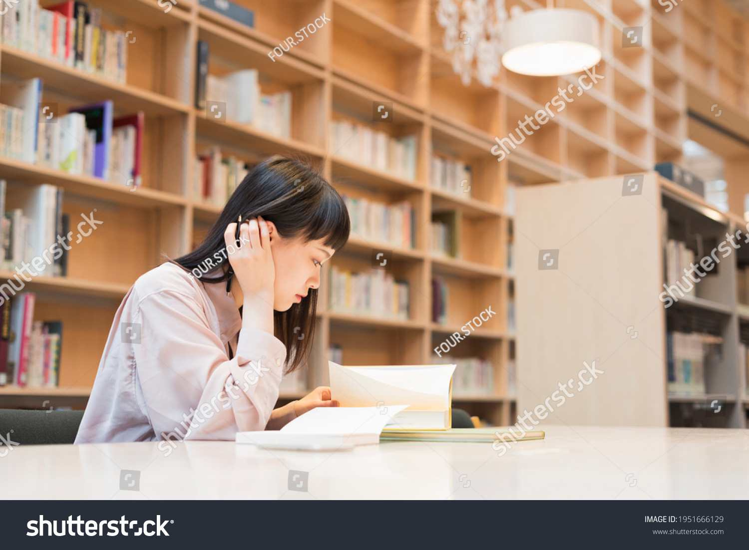 Female college student in the library #1951666129
