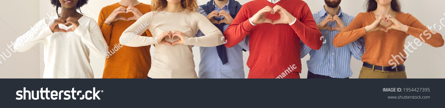 Group of thankful youth and senior citizens showing love and support and sending gratitude. Banner with midsection shot of young and mature people doing heart shape hand gesture #1954427395