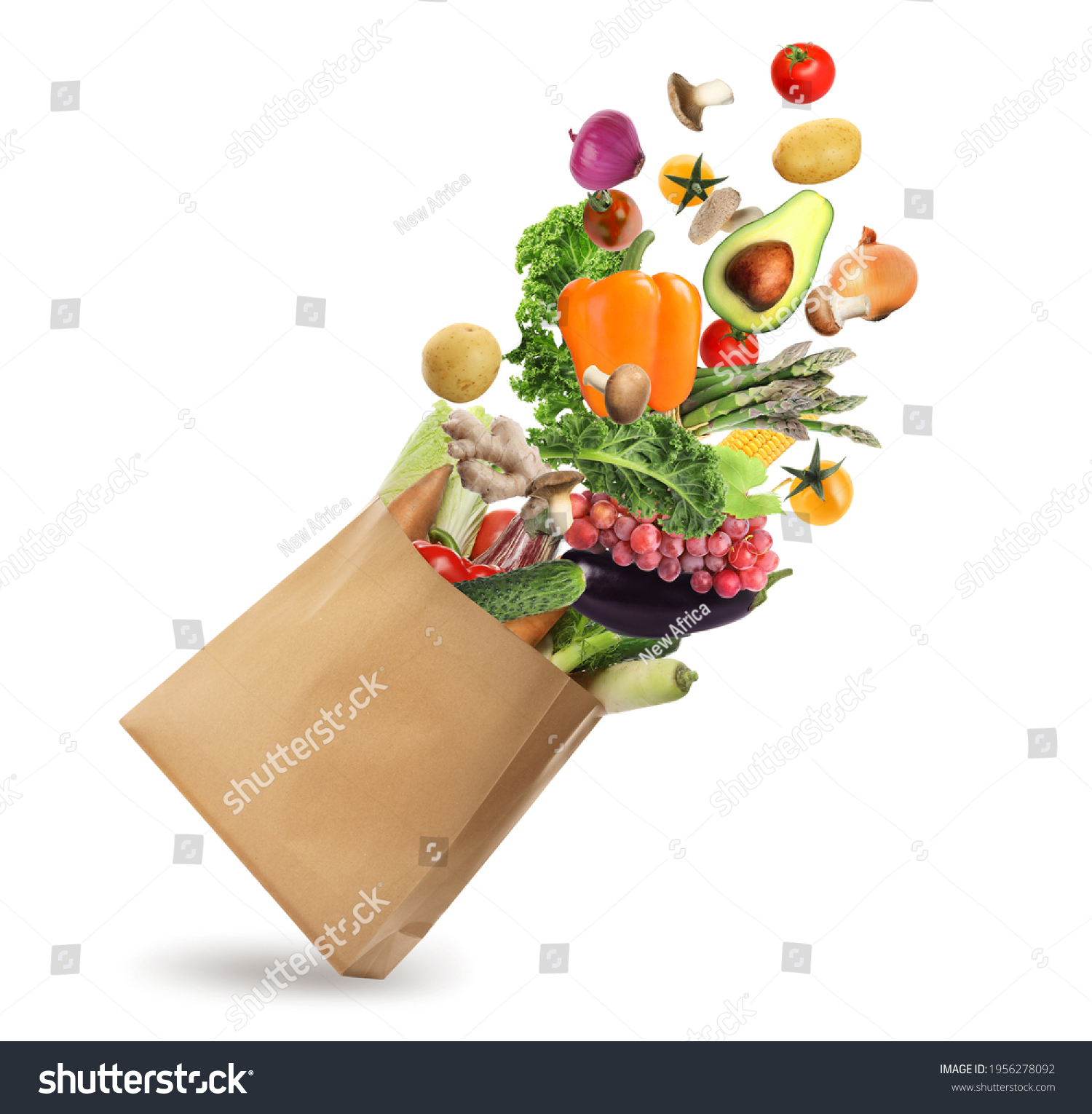 Paper bag with vegetables and fruits on white background. Vegetarian food  #1956278092