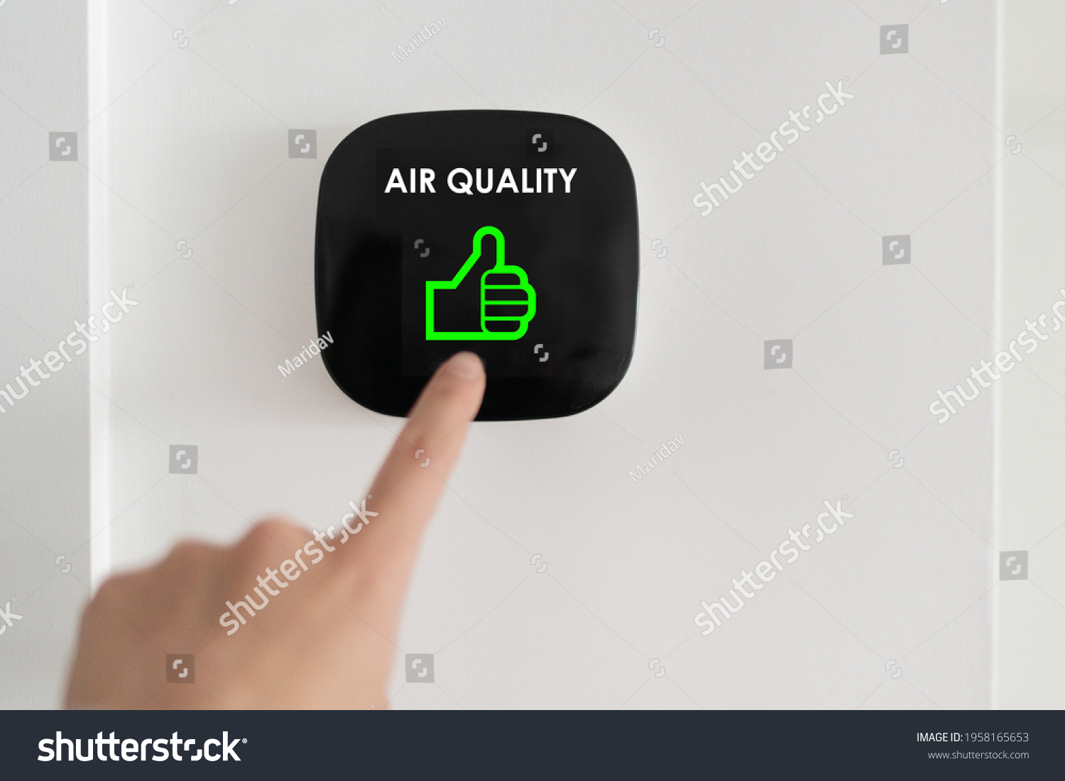 Good air quality indoor smart home domotic touchscreen system. air. Woman touching touchscreen checking air purifier filter at green level with thumbs up graphics. #1958165653