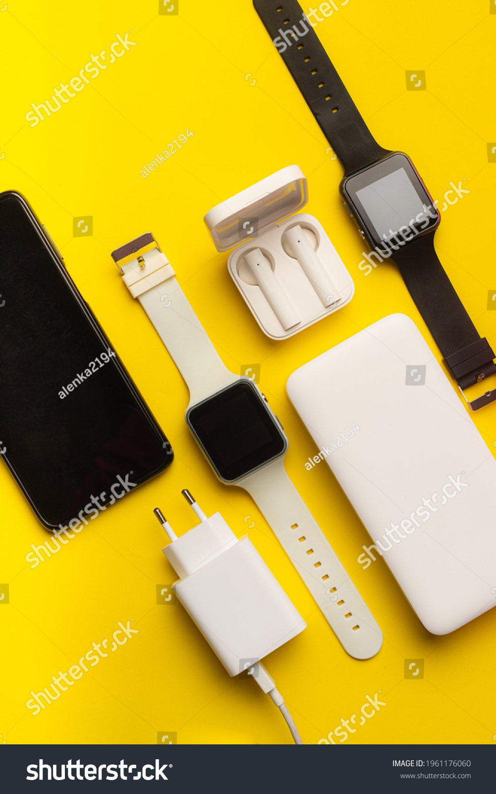 Layout of modern gadgets on a yellow background . Online communication. Internet connection. Mobile communication. 5g. Black and white technology. Modern technologies. Copy space #1961176060