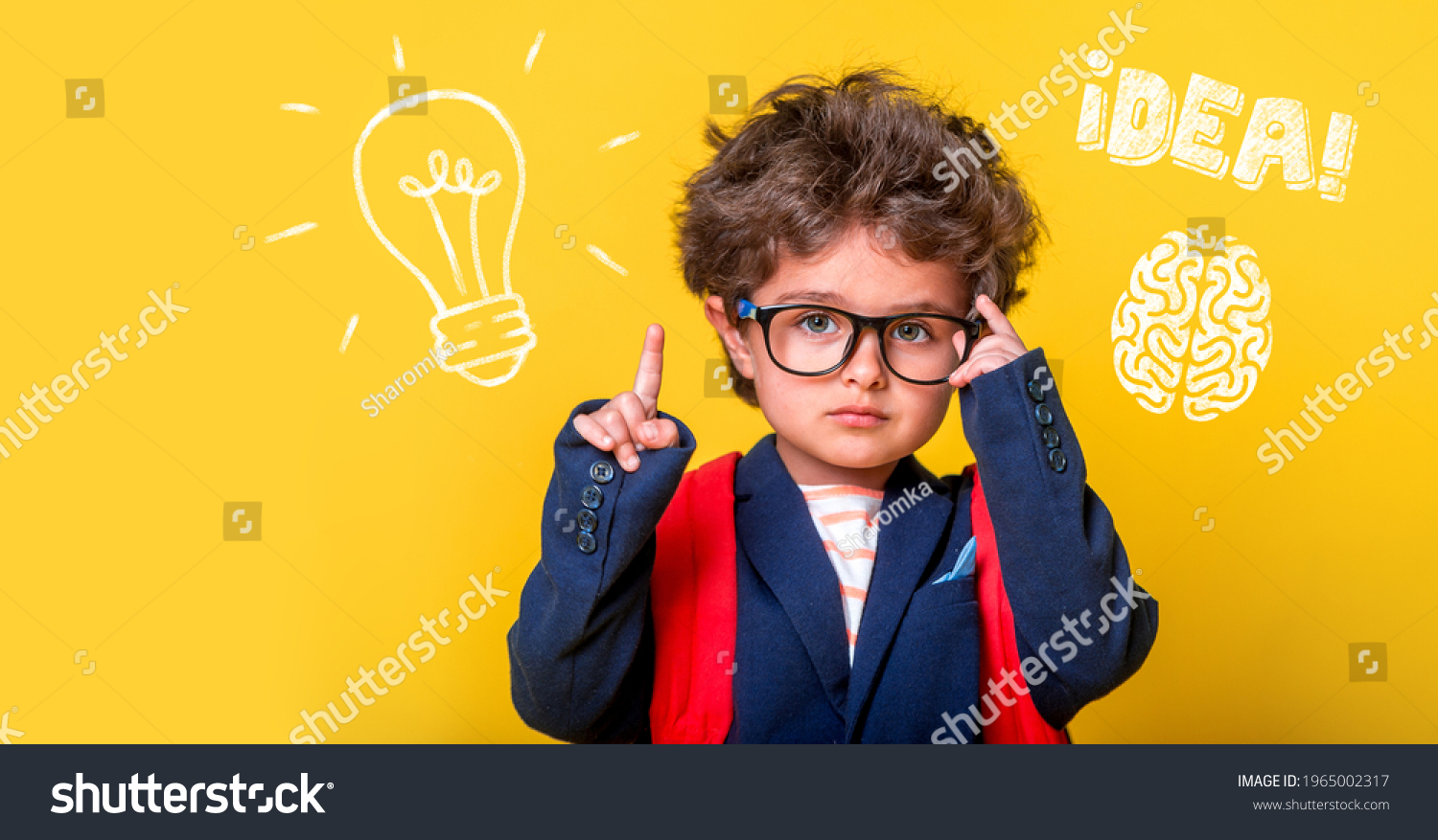 Small smart child in glasses with bag isolated on yellow. Little genius student thinking with lightbulb and math formulas. Student has idea. Pupil with picture of brain. Kindergarten kid go to school. #1965002317