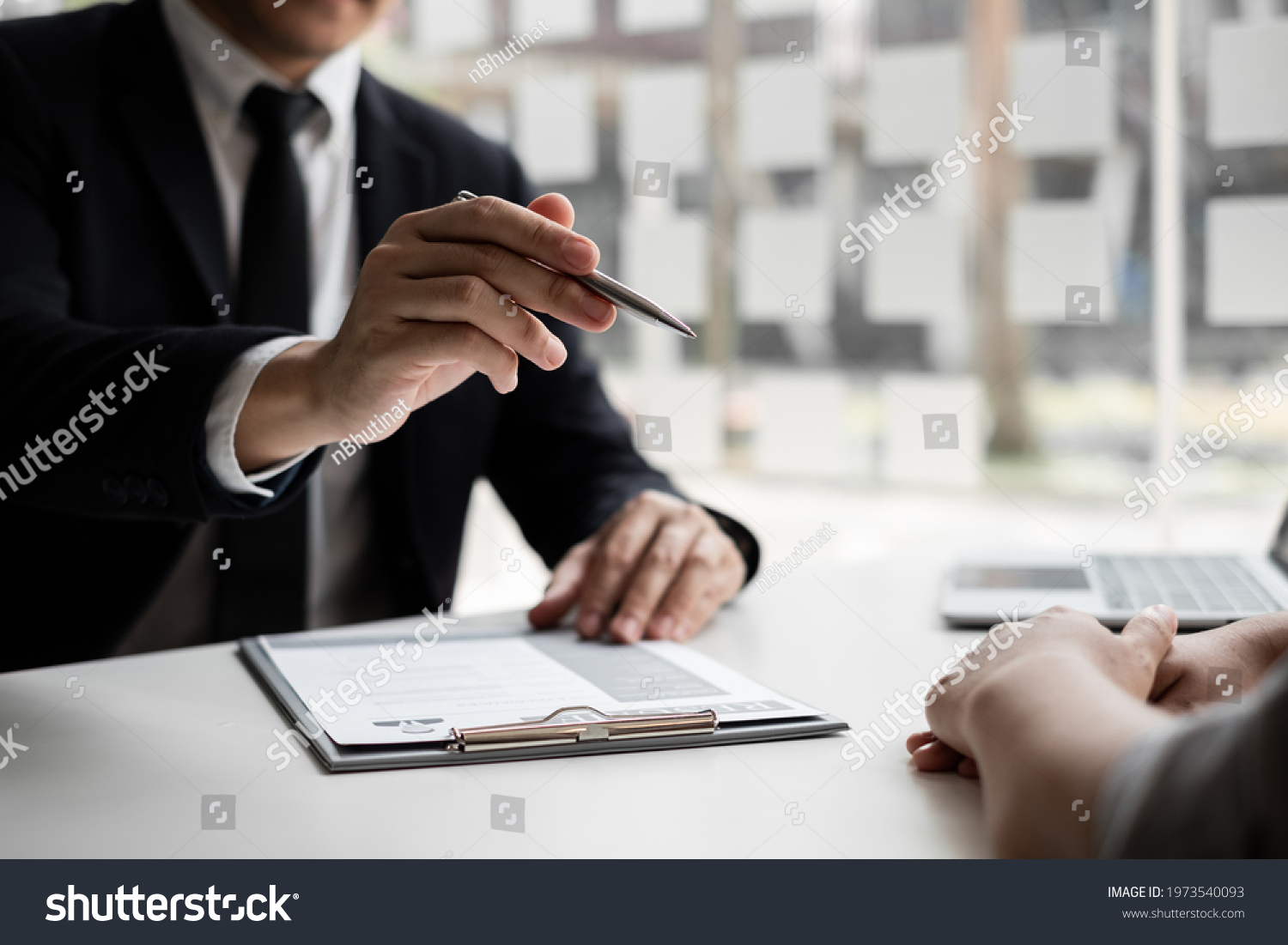 Interview employee talking about resume and job description with job applicants sitting in front in the office, Job applications concepts. #1973540093