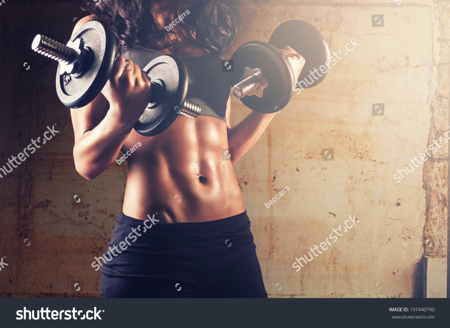 Fitness woman in training.Strong abs showing #197440790