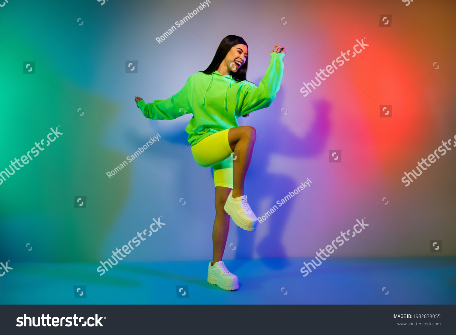 Full length body size view of lovely funky cheery girl dancing clubbing chill out isolated over multicolor vivid neon light background #1982878055