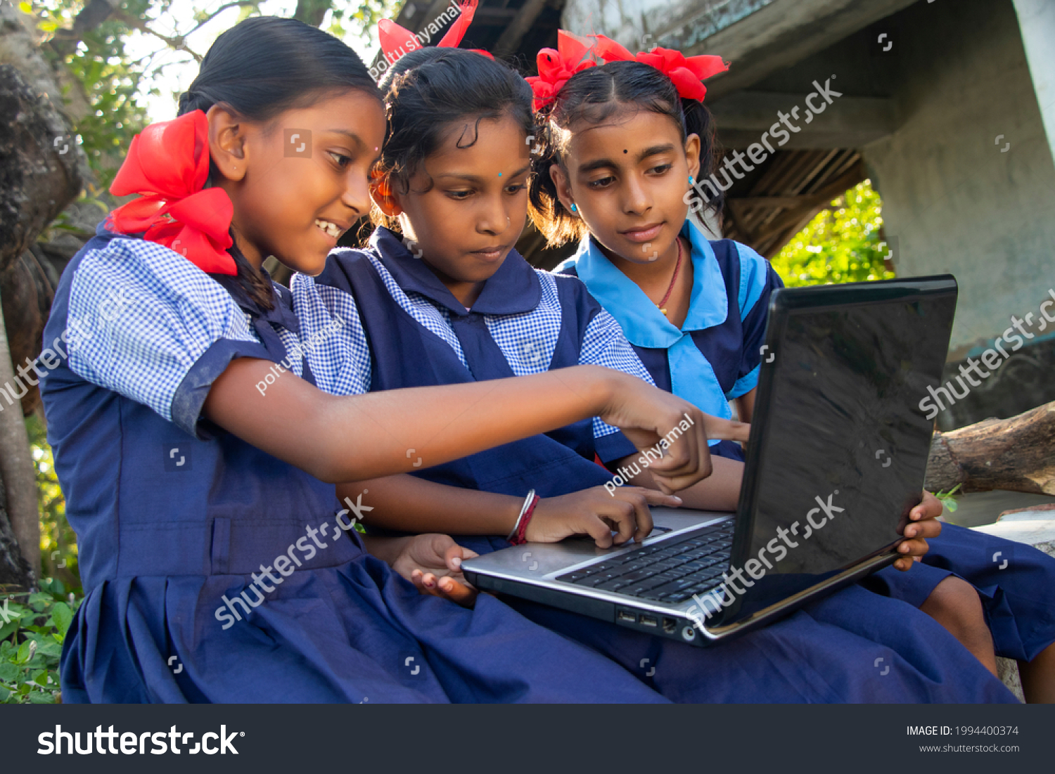 indian village government school girls operating laptop computer system at rural area in india #1994400374