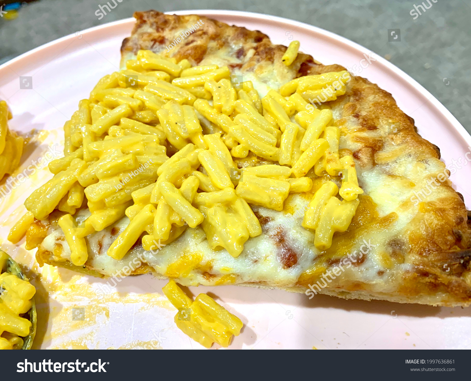 Macaroni and cheese on top of cheese pizza #1997636861