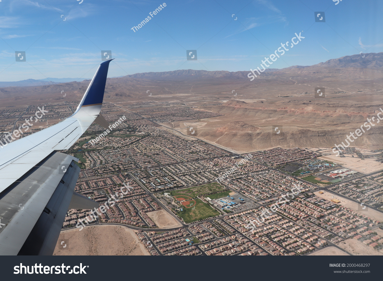 Point of view of a plane over the periphery of Las Vegas with the plane's garlic, The picture was shoot in Las Vegas, Usa, the 29 july 2019.  #2000468297