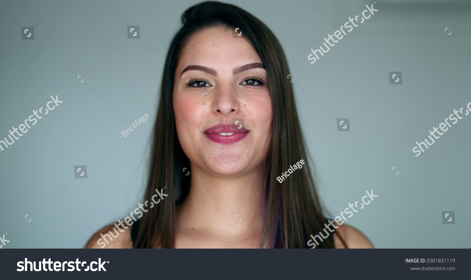 Beautiful young woman bursting laughing out loud. Pretty girl real life spontaneous smile and laugh #2001831119
