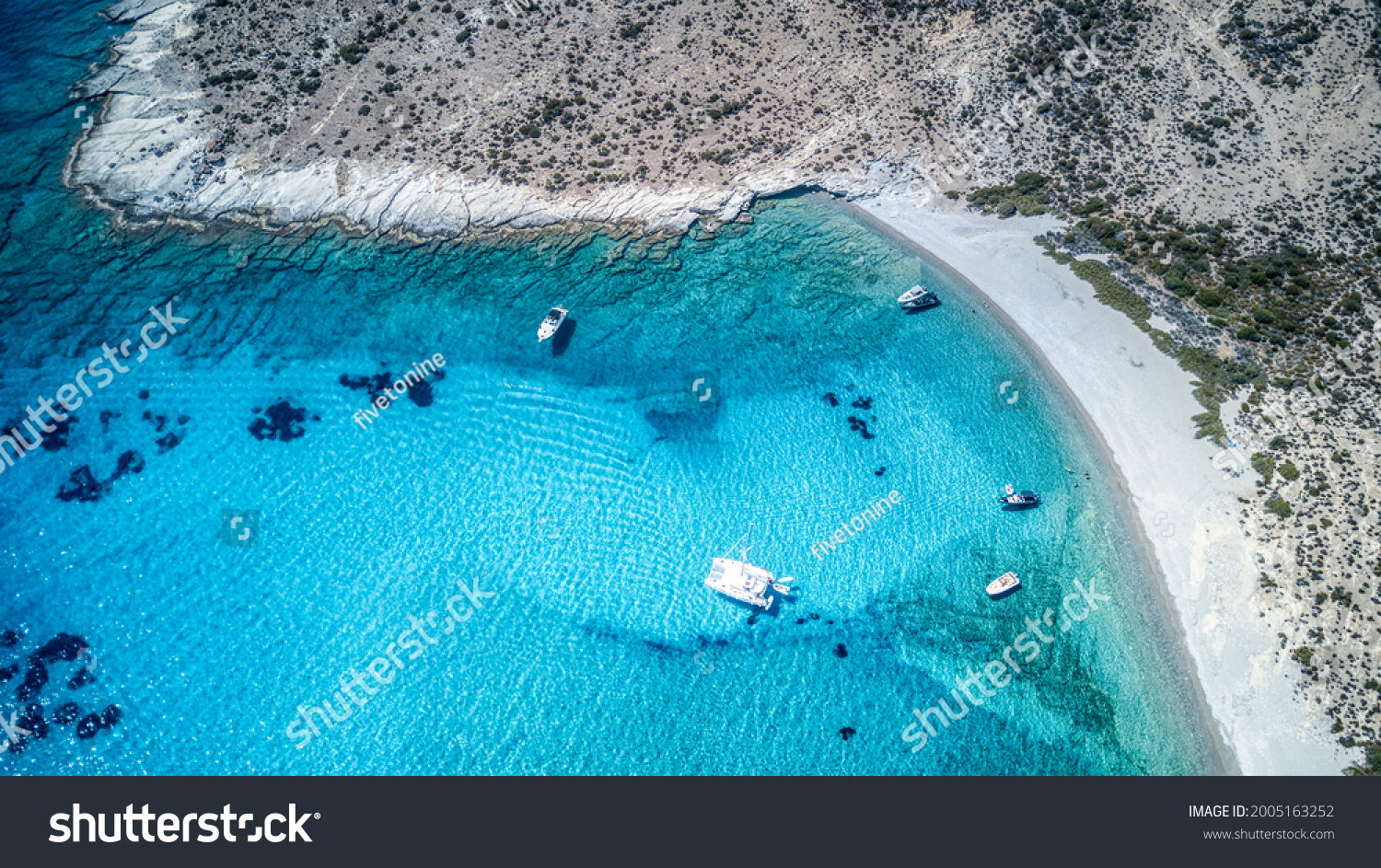The turquoise blue beach on the uninhabited Polyaigos island in the Greek Cyclades #2005163252