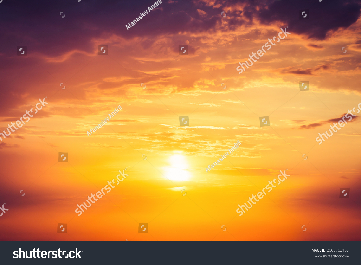 Beautiful colorful dramatic sky with clouds at sunset or sunrise. #2006763158