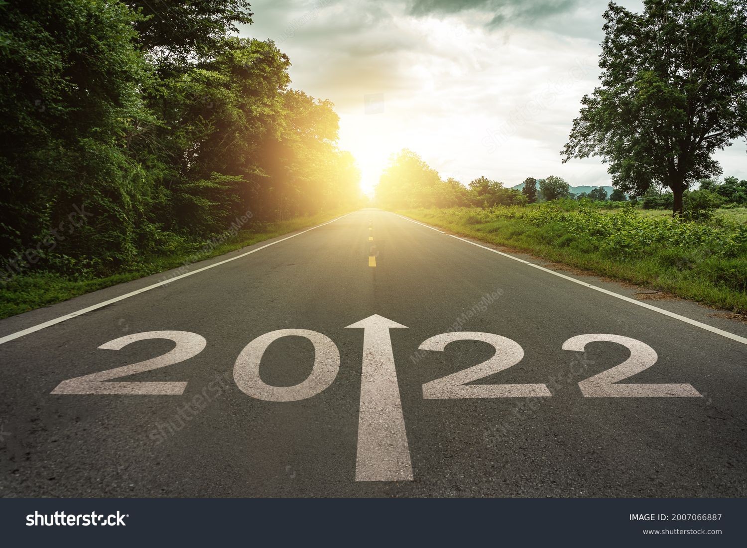 New year 2022 or straightforward concept. Text 2022 written on the road in the middle of asphalt road at sunset.Concept of planning and challenge, business strategy, opportunity ,hope, new life change #2007066887