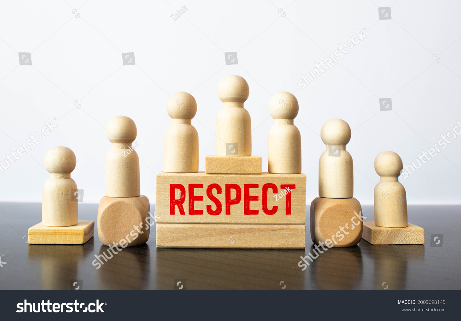 Respect word written on wood block. respect text on table, Business ethics concept #2009698145