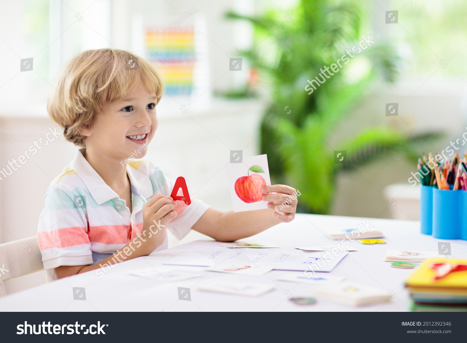 Kids learn to read. Colorful abc phonics flash cards for kindergarten and preschool children. Remote learning and homeschooling for young kid. Child reading sounds and letters. English lesson. #2012392346