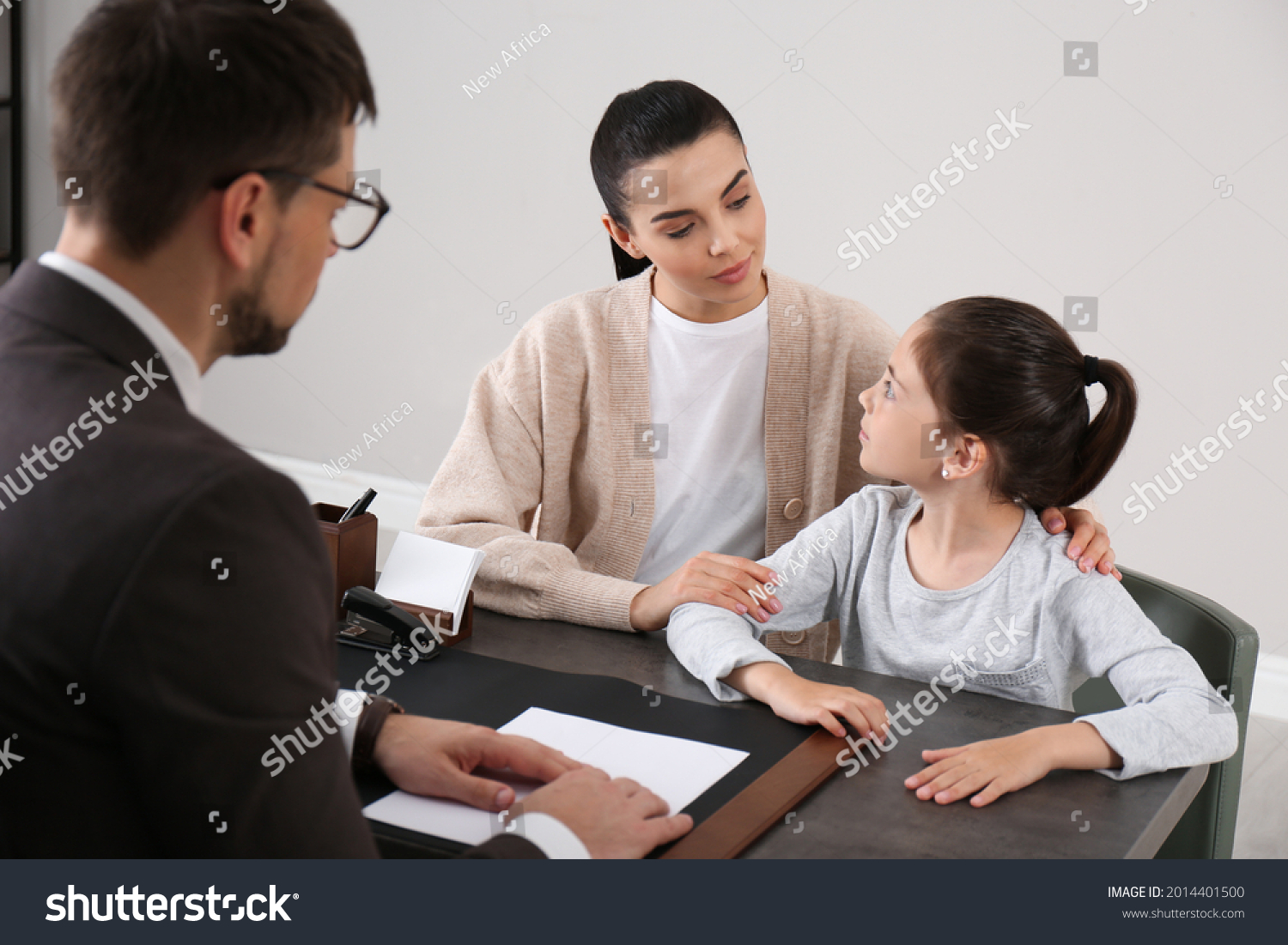 Mother and daughter having meeting with principal at school #2014401500