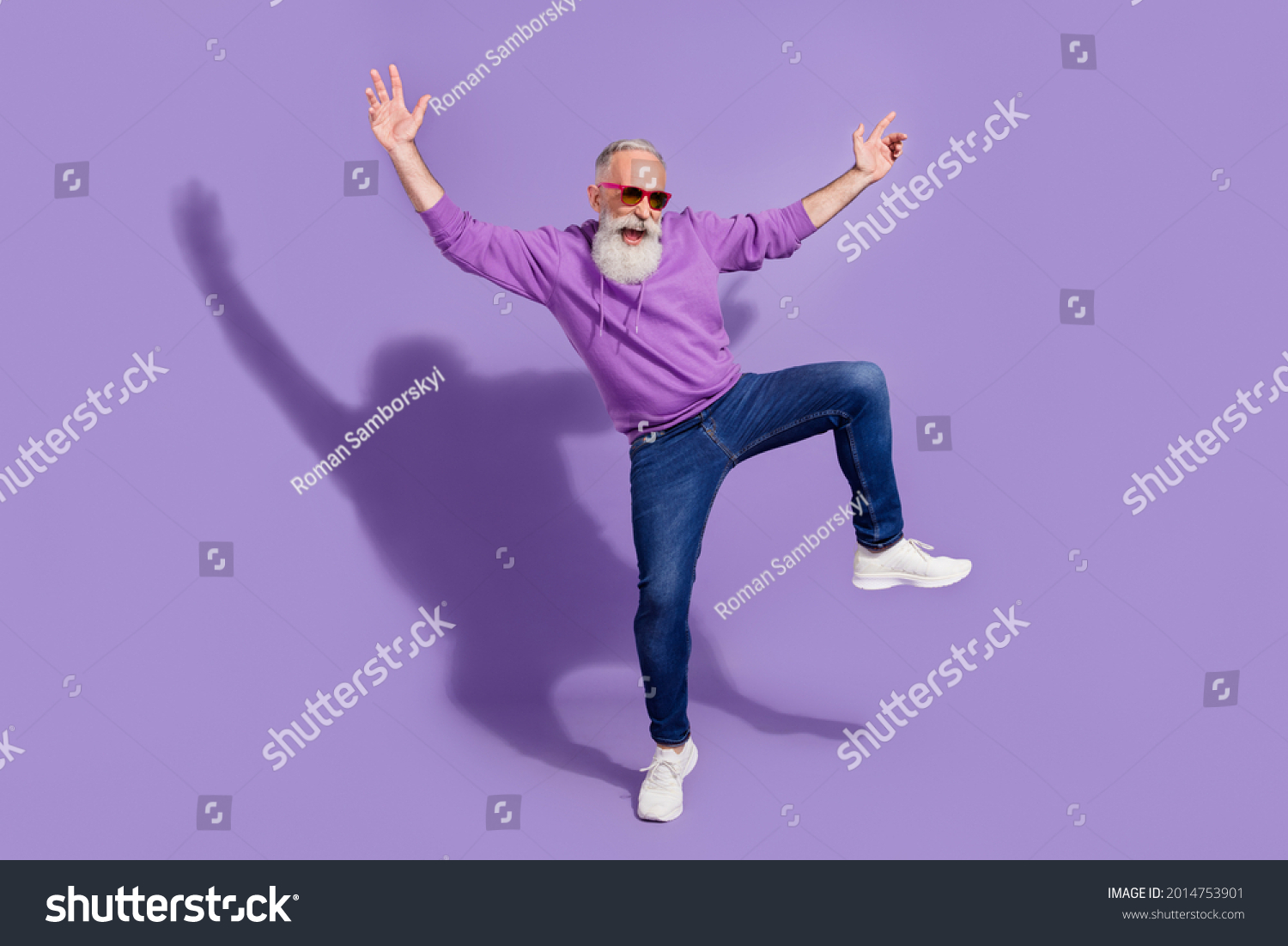 Full length body size view of attractive elderly retired cheery grey-haired man guy dancing fooling isolated over purple violet color background #2014753901