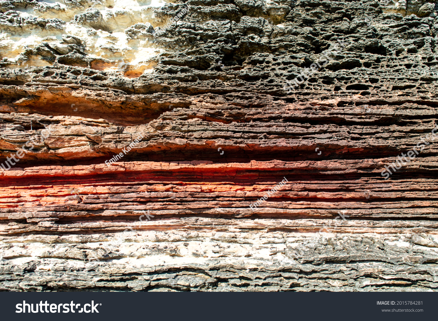 Layers of sedimentary sandstone rock. rock formations in red, white and gray. structure background #2015784281