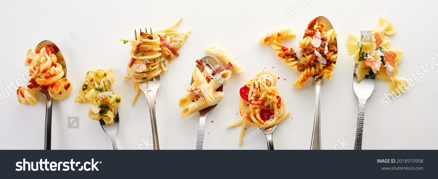 Various types of yummy pasta on spoons and forks (carbonara, spaghetti bolognese, pasta penne arrabiata, fusilli pasta bolognese) #2018970998